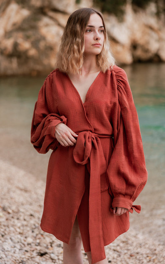 Woman wearing a terracotta Bohemian Resort Kimono by Bohème by Ena by the sea
