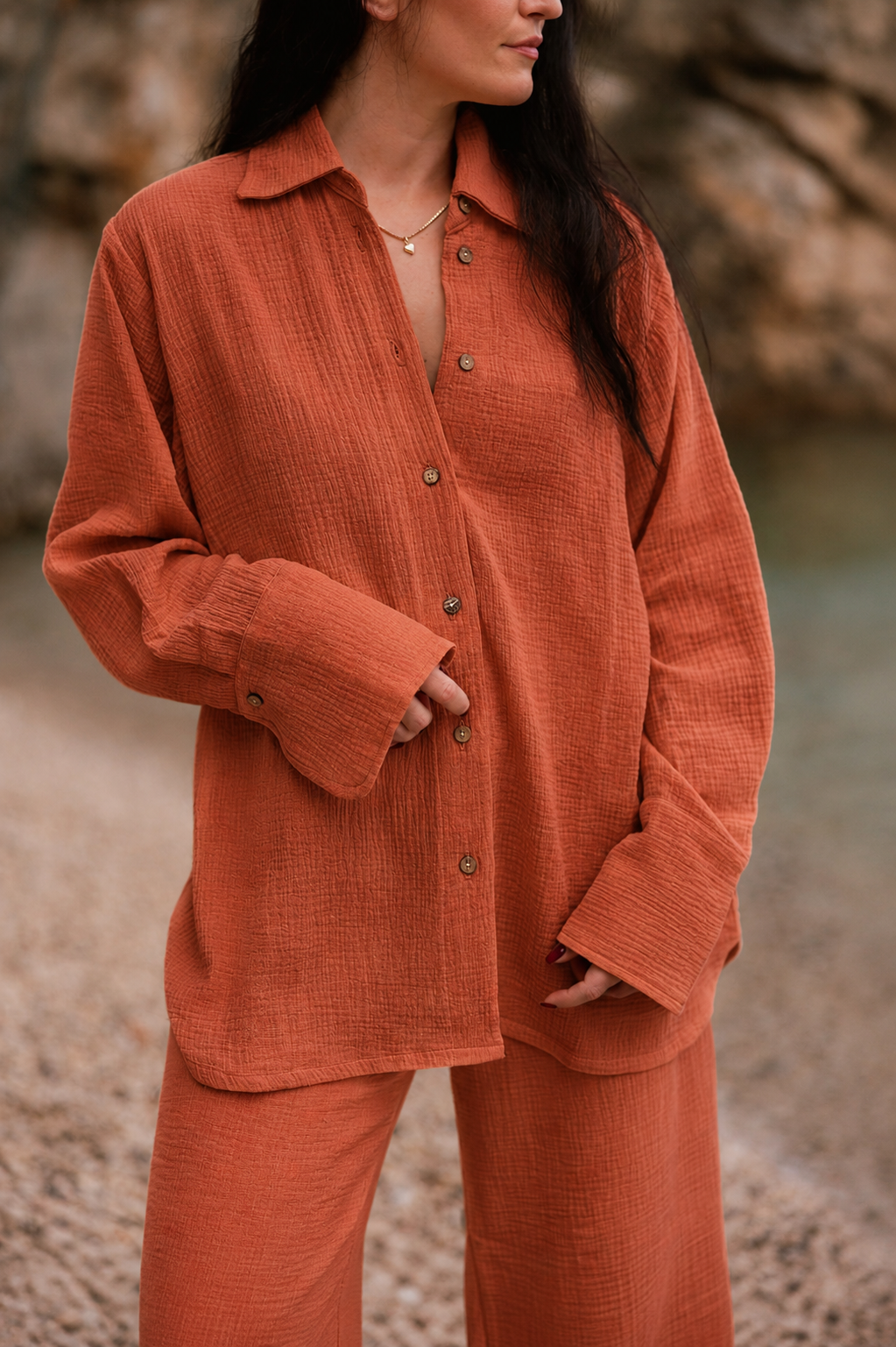 Woman wearing the terracotta Coconut matching shirt and pants set in a relaxed fit
