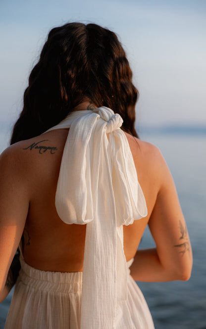 Back view of the white Mayan Goddess Maxi Dress showing the open-back design