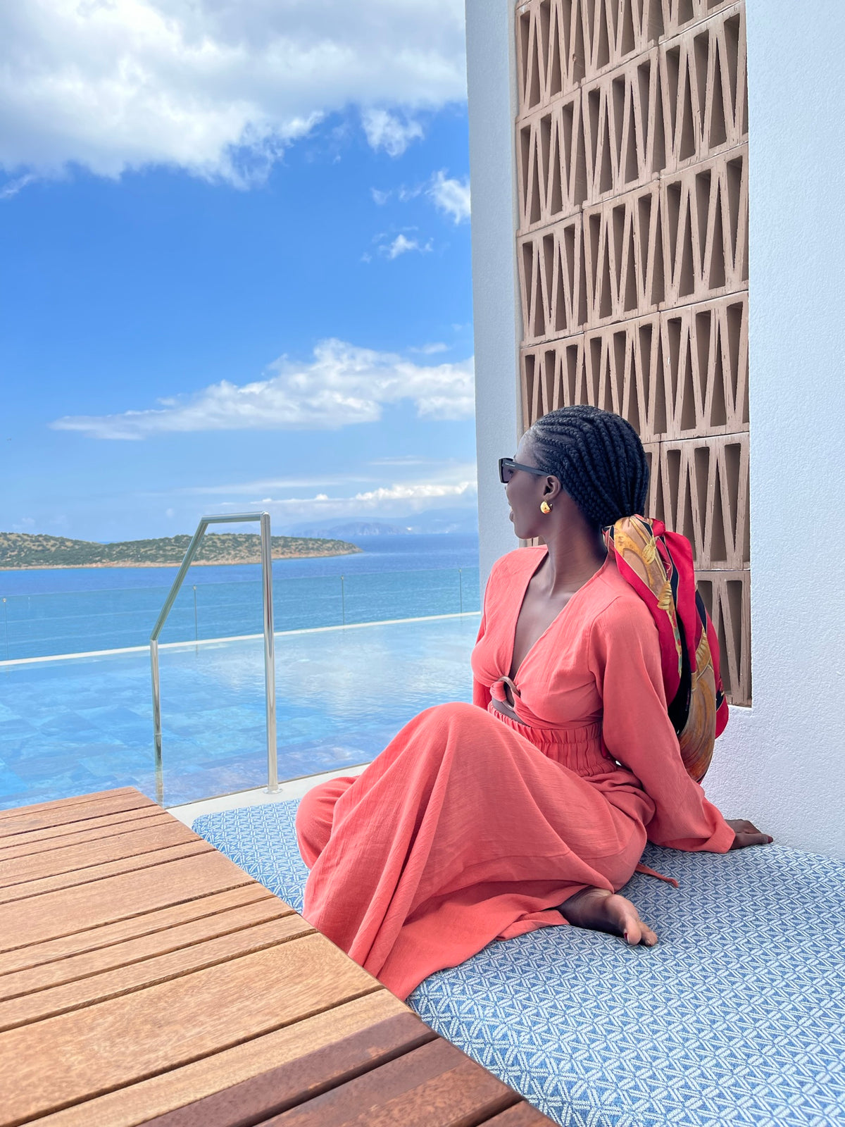 Woman wearing the terracotta Mexico Bohemian Set while relaxing by the sea