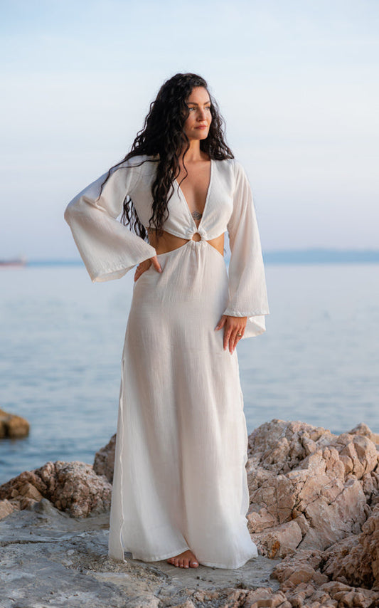 Woman wearing the white White Oleander Maxi Dress by Bohème by Ena by the sea
